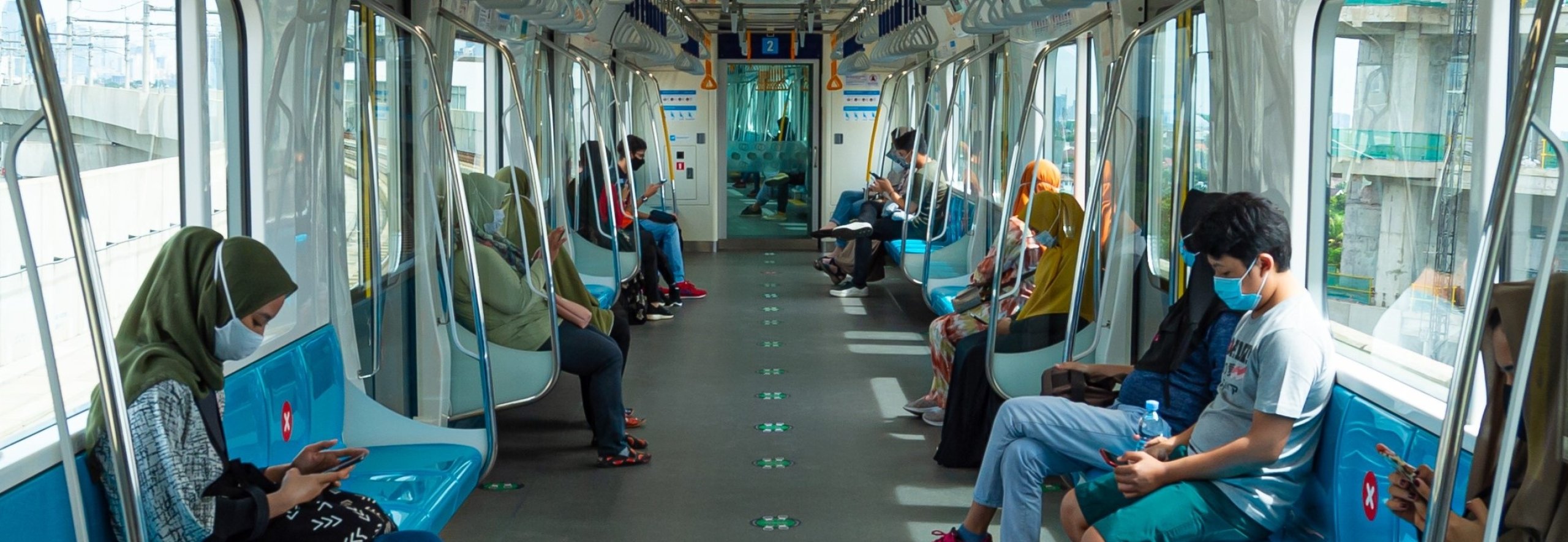People sitting in Jakarta rail car