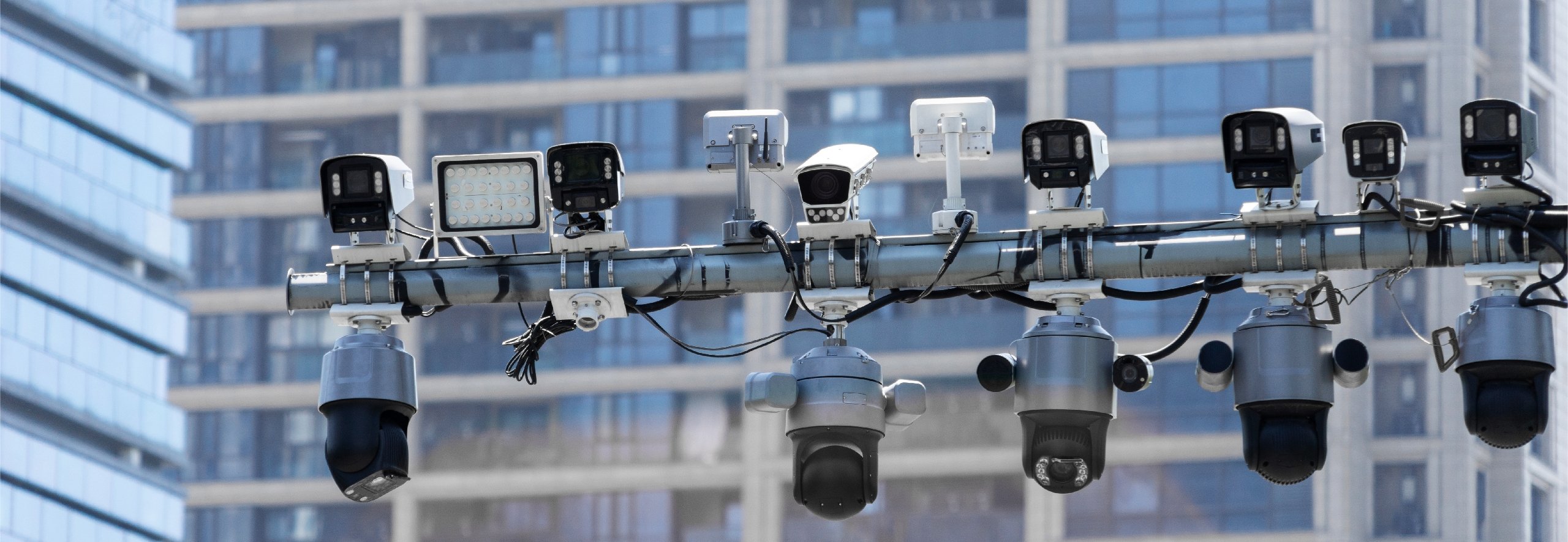 Smart city surveillance cameras near a building