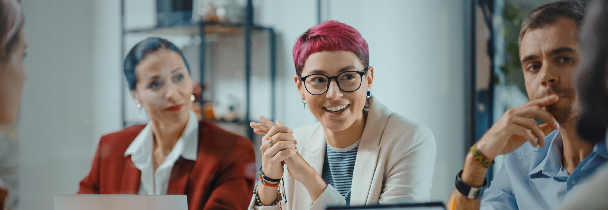 Diverse group of employees in a meeting representing equity and inclusion