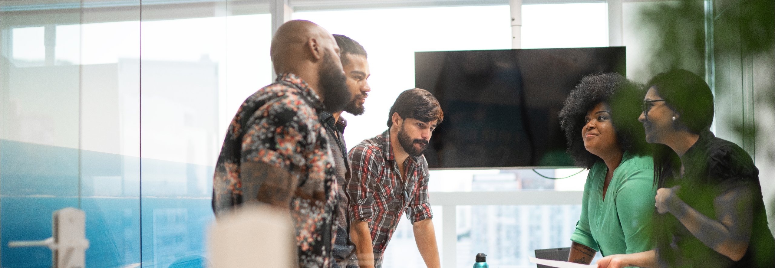 Group of diverse business colleagues collaborating in a conference room