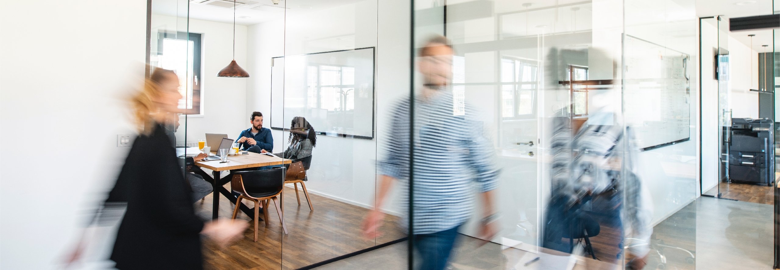 Business professionals walking through modern office space