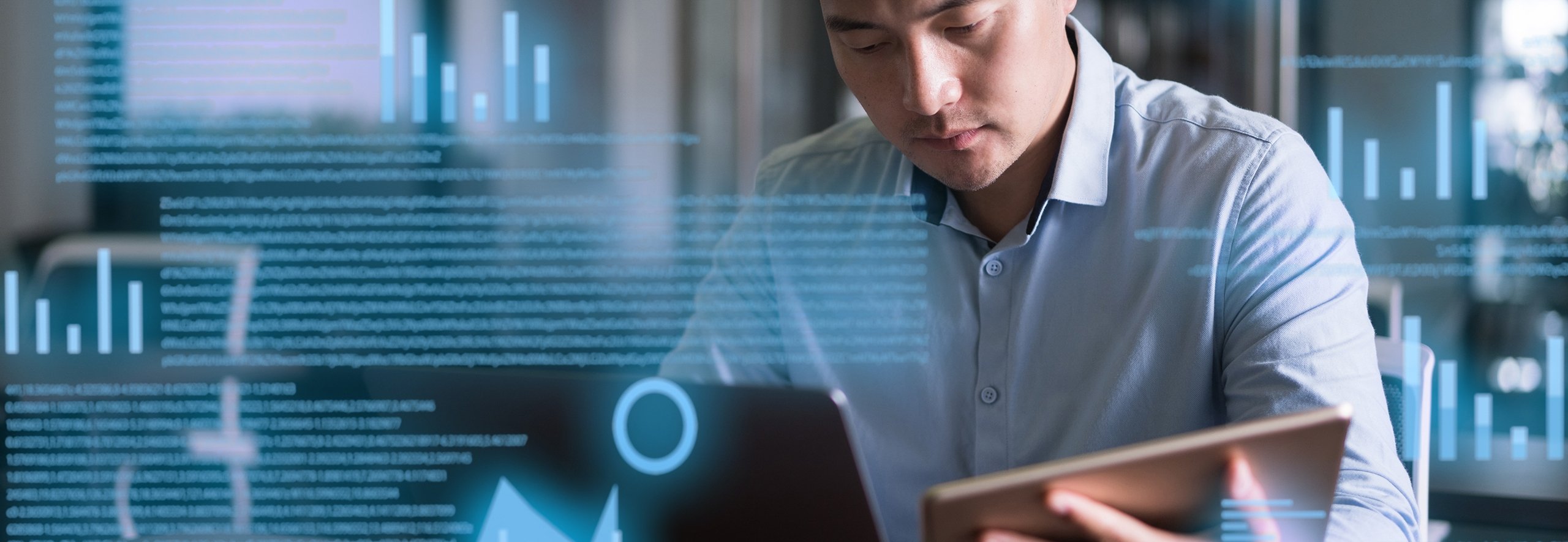 Asian man reading text on a projected screen