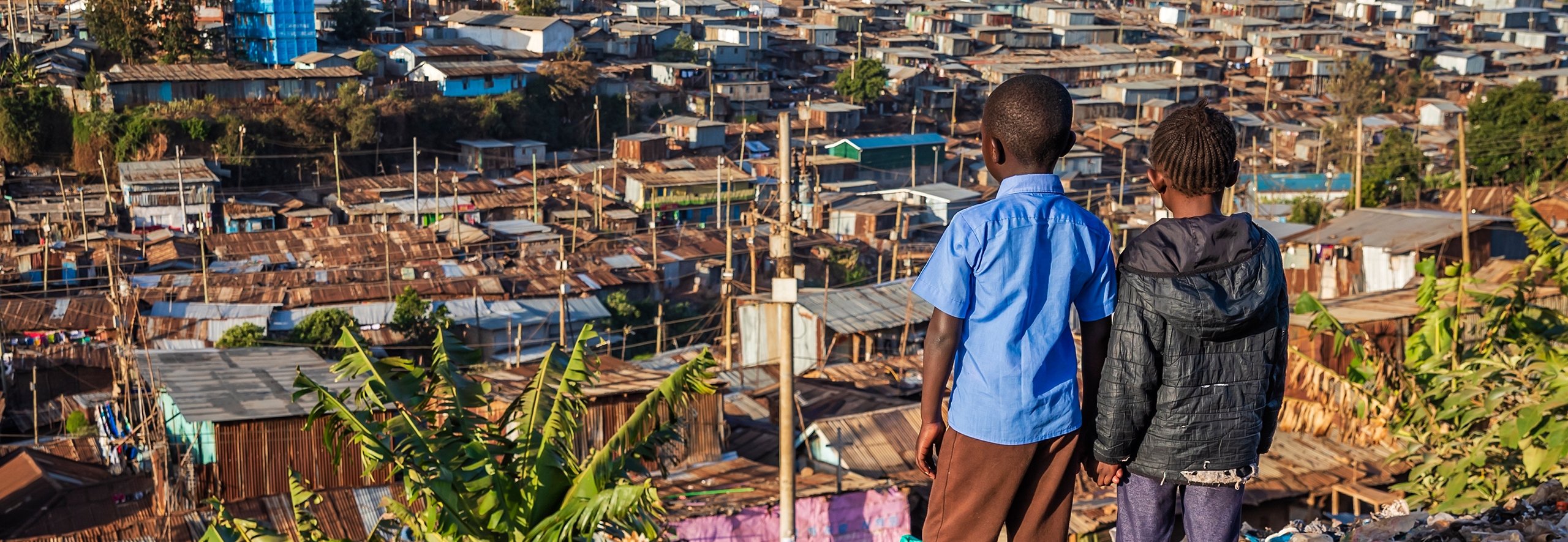 African children overlooking a slum in Nairobi, Kenya