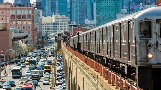 image of above ground subway train in New York