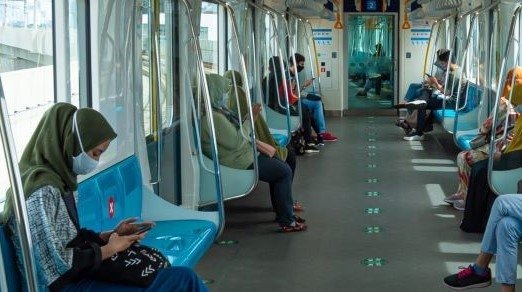 people sitting in train car in Jakarta