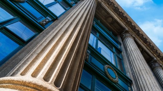 building with a roman column