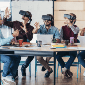image of colleagues in a virtual meeting using VR goggles